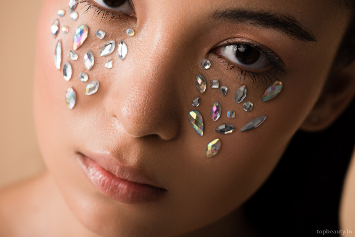 Rhinestones on the face: a new bright trend